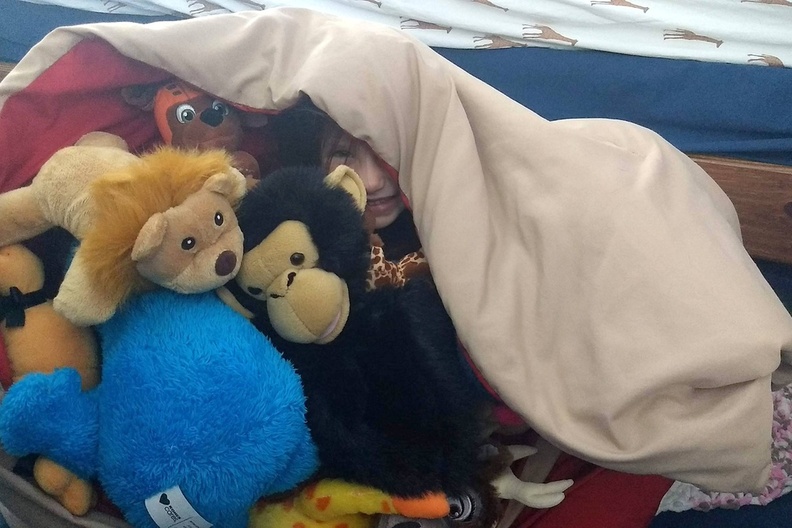 Evie in a Pile of Friends