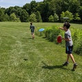 They Race to their Discs to See Who Wins the Hole