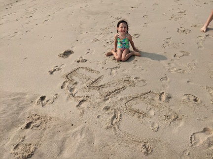 Writing Her Name in the Sand