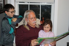 Sharing Her Tadpole Book With Papa