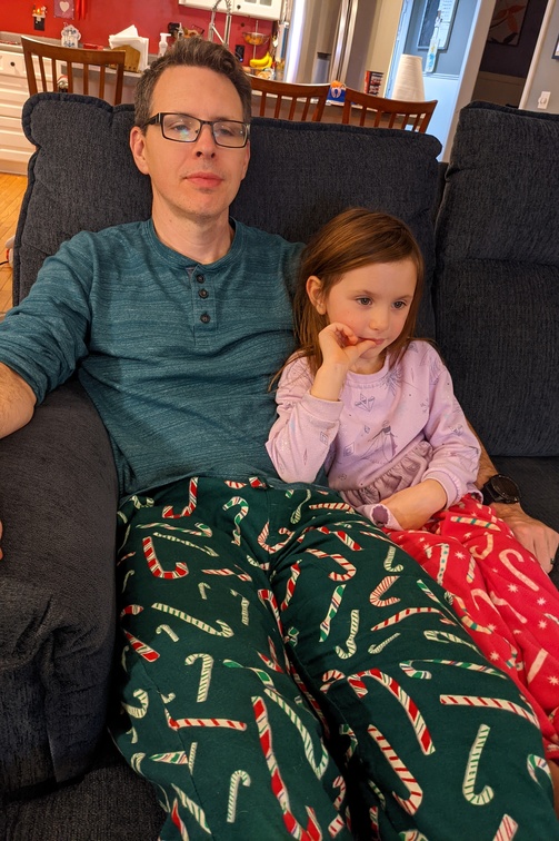Snuggling Candy Cane Wearers Watching the Grinch