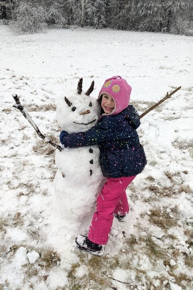 She Loves Her Snowman She Made With Daddy