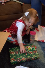 Very Carefully Opening Her Gift