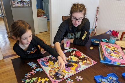 Puzzling With Her Big Cousin