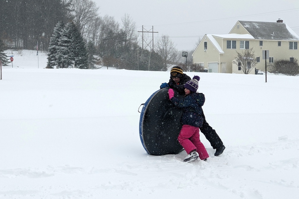 Trying to Get the Snow Tube Through the Snow