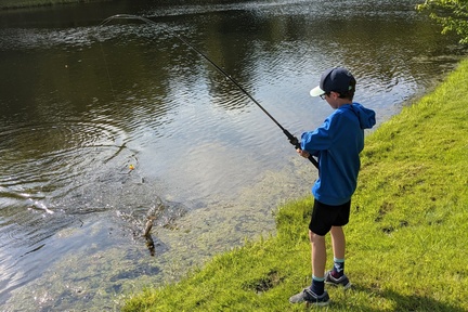 Reeling In His First Fish