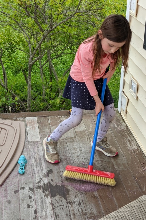 Cleaning the Porch of Her Sand