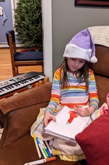 Coloring in Her Santa Hat