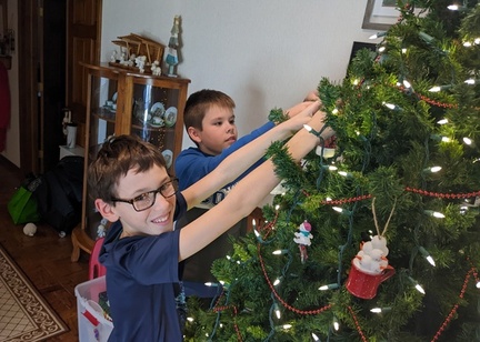 Boys Helping to Hang Ornaments