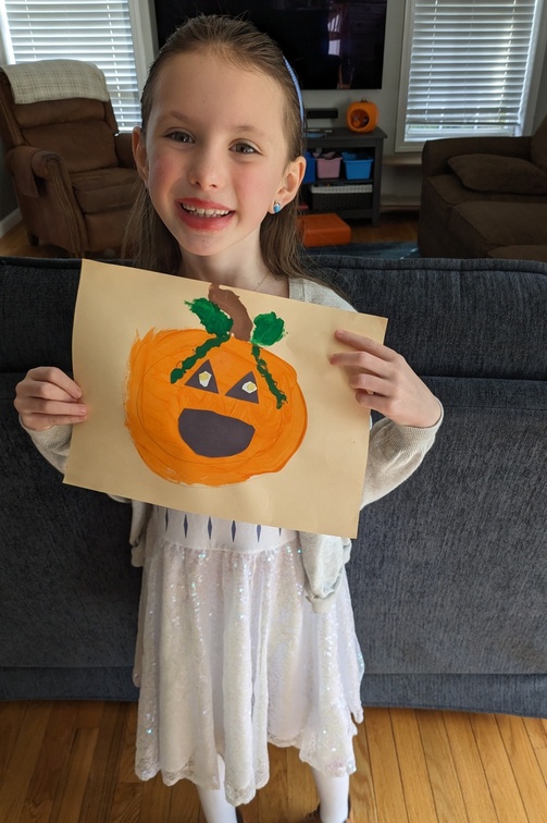 Showing Off Her Pumpkin Art