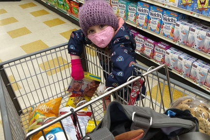 Big Girl Helping Fill the Grocery Cart