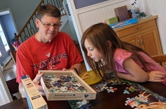 Grandpa Providing Puzzle Assistance