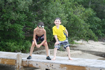 Thomas and Isaac Hamming It Up on the Dock