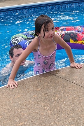 Cold Little Girl Muscling Out of the Pool