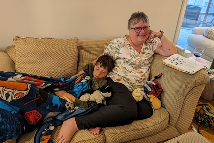 Tuckered Boy Snuggling With His Grandma